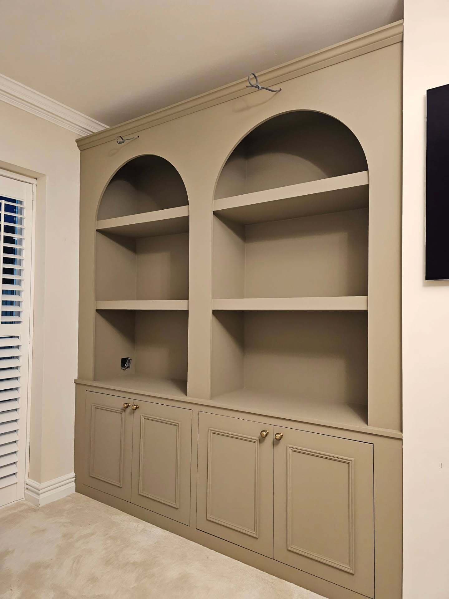 Elegant arched alcove storage units