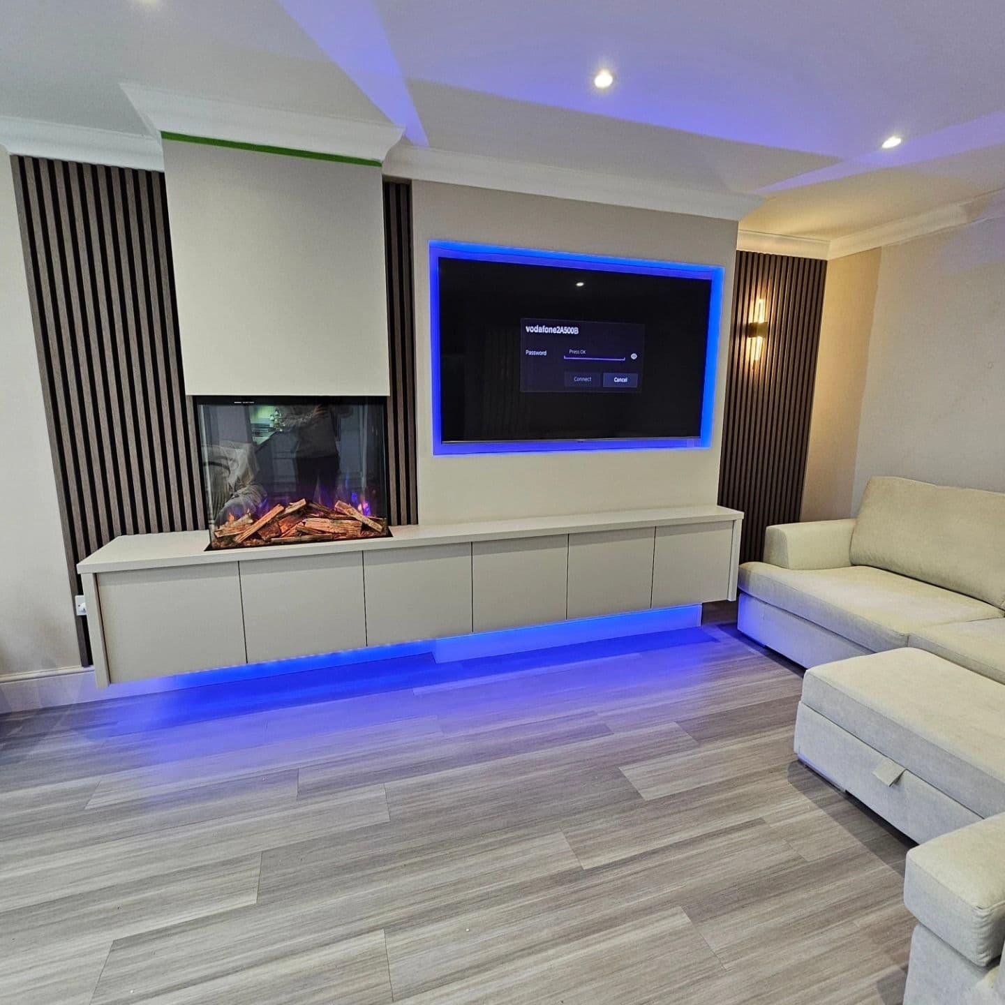 Luxury media wall with blue LED lighting